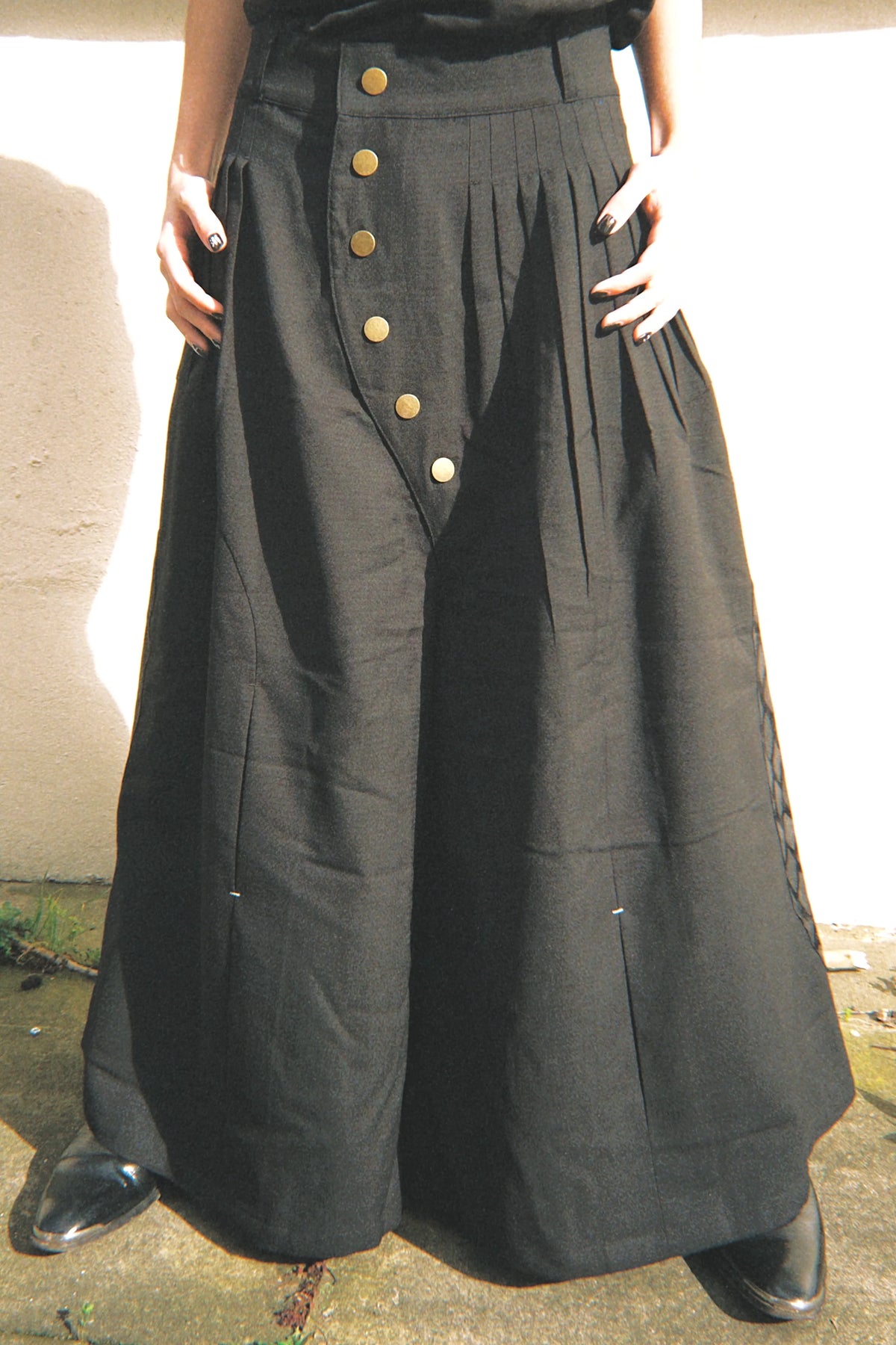 Schimitar-pleated wide wool trousers